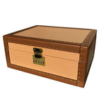 Brown and beige storage trunk with gold brass hardware on a white background