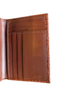 Open cognac crocodile leather wallet with card slots and stitched edges