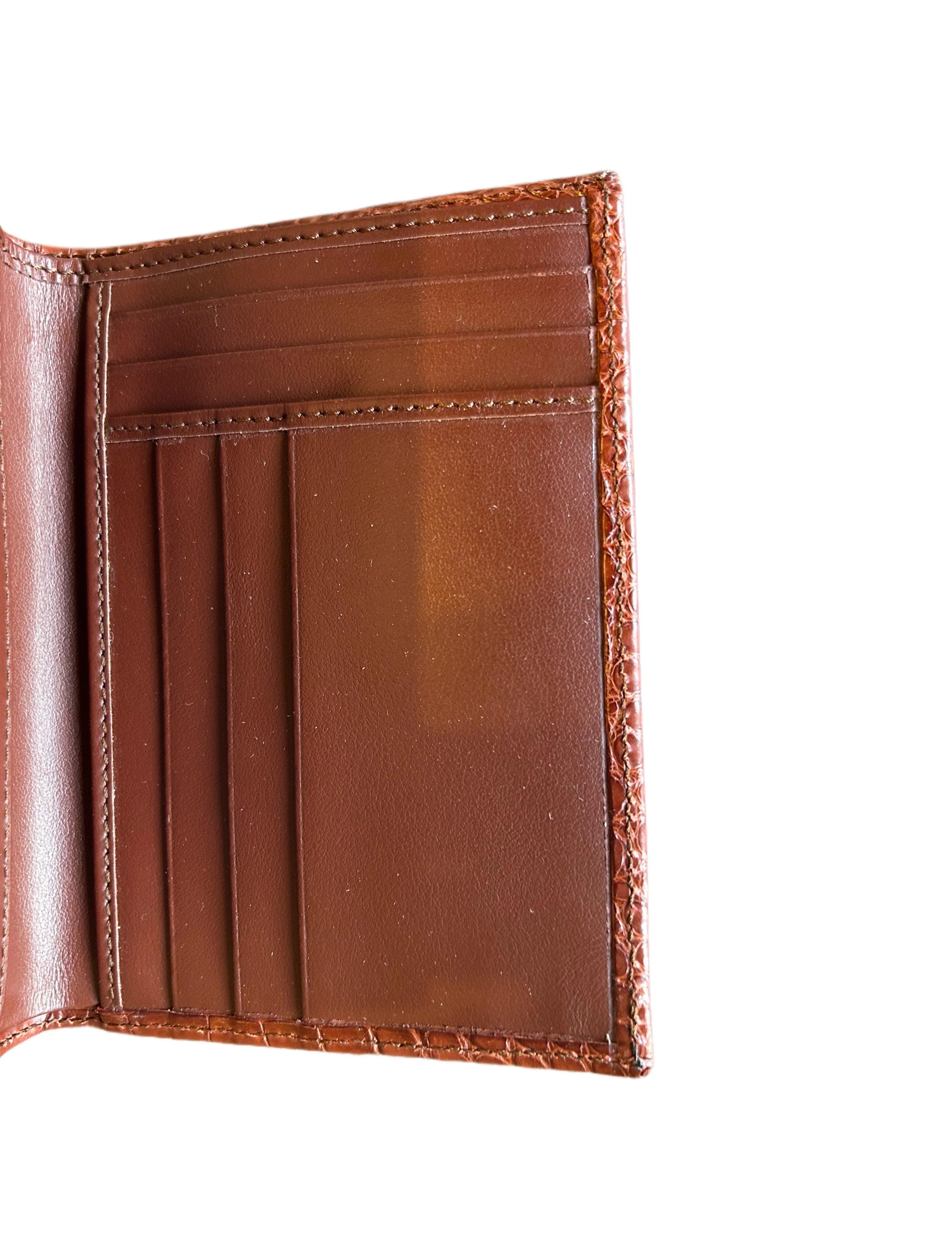 Open brown leather wallet with card slots and stitched edges, luxury Italian craftsmanship