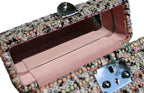 Black Mirror Handbag close-up of palladium-finished brass clasp