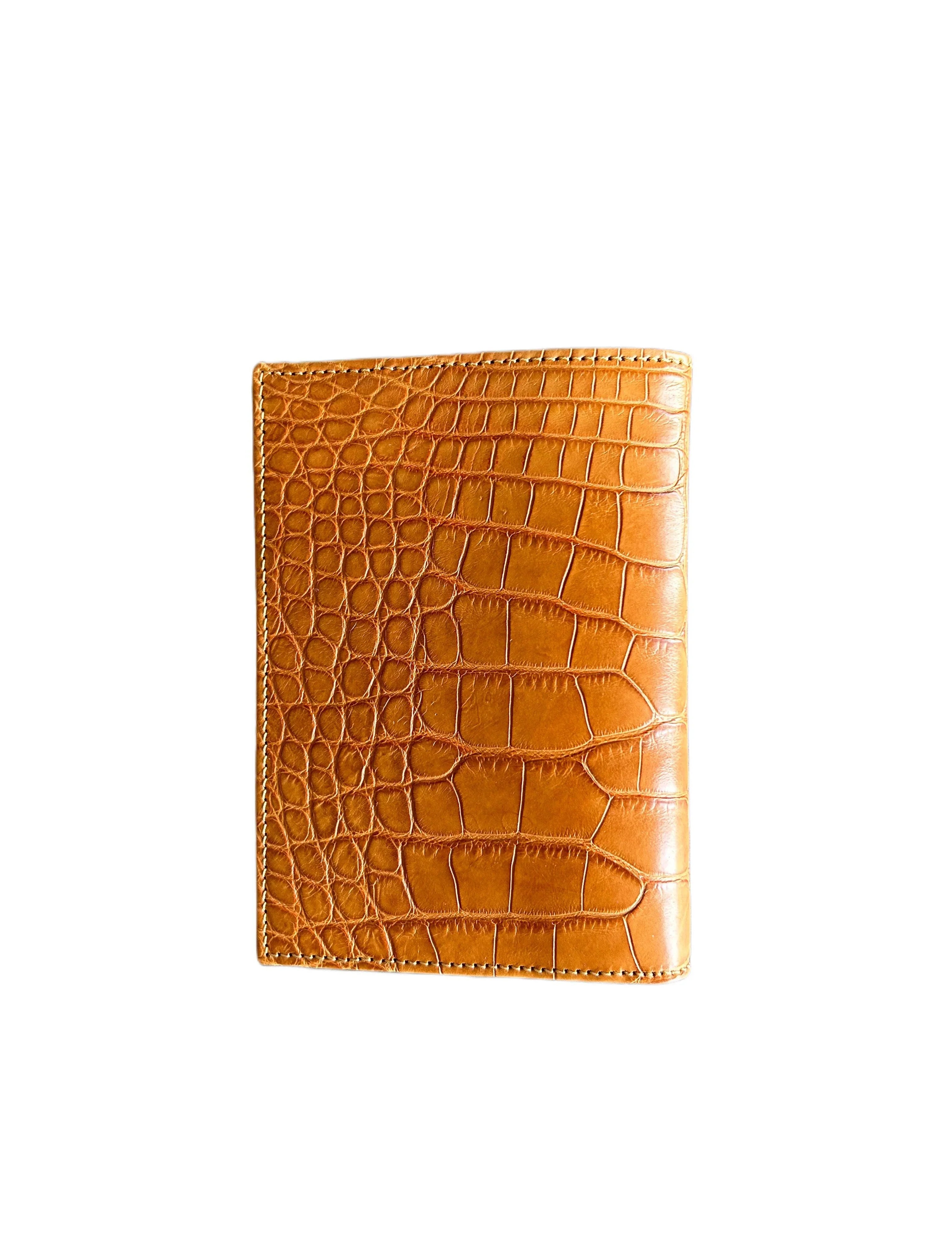 Tan crocodile-embossed Italian leather wallet, handcrafted, luxury accessory on white background