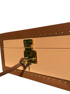 Close-up of a brown leather box with a gold lock on a white background