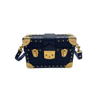 Ostrich leather mini trunk handbag side view showing stud detail