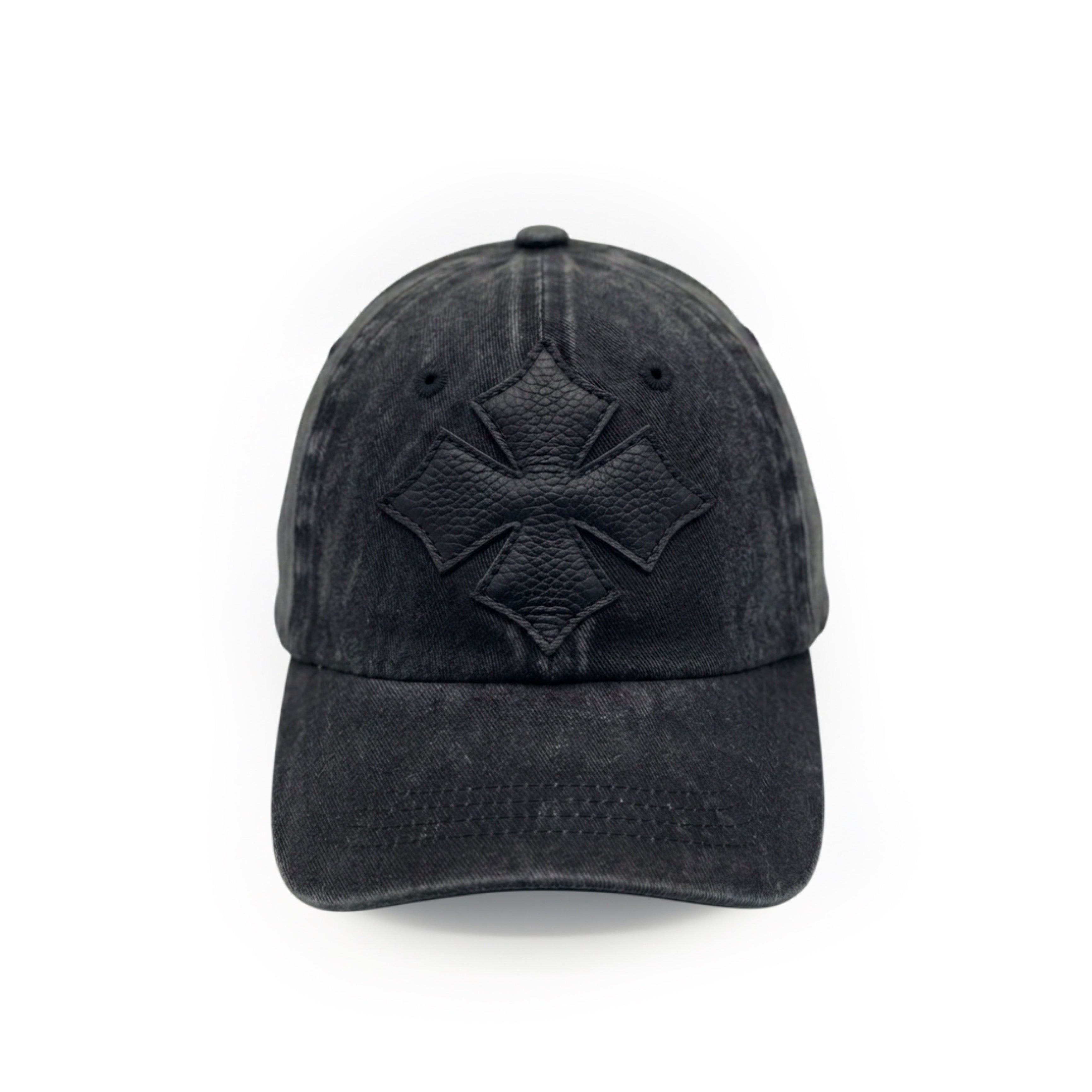 Front view of a black washed cotton six-panel baseball cap with a tonal black calf leather logo patch