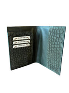 Open handcrafted Italian leather wallet with textured pattern and card slots