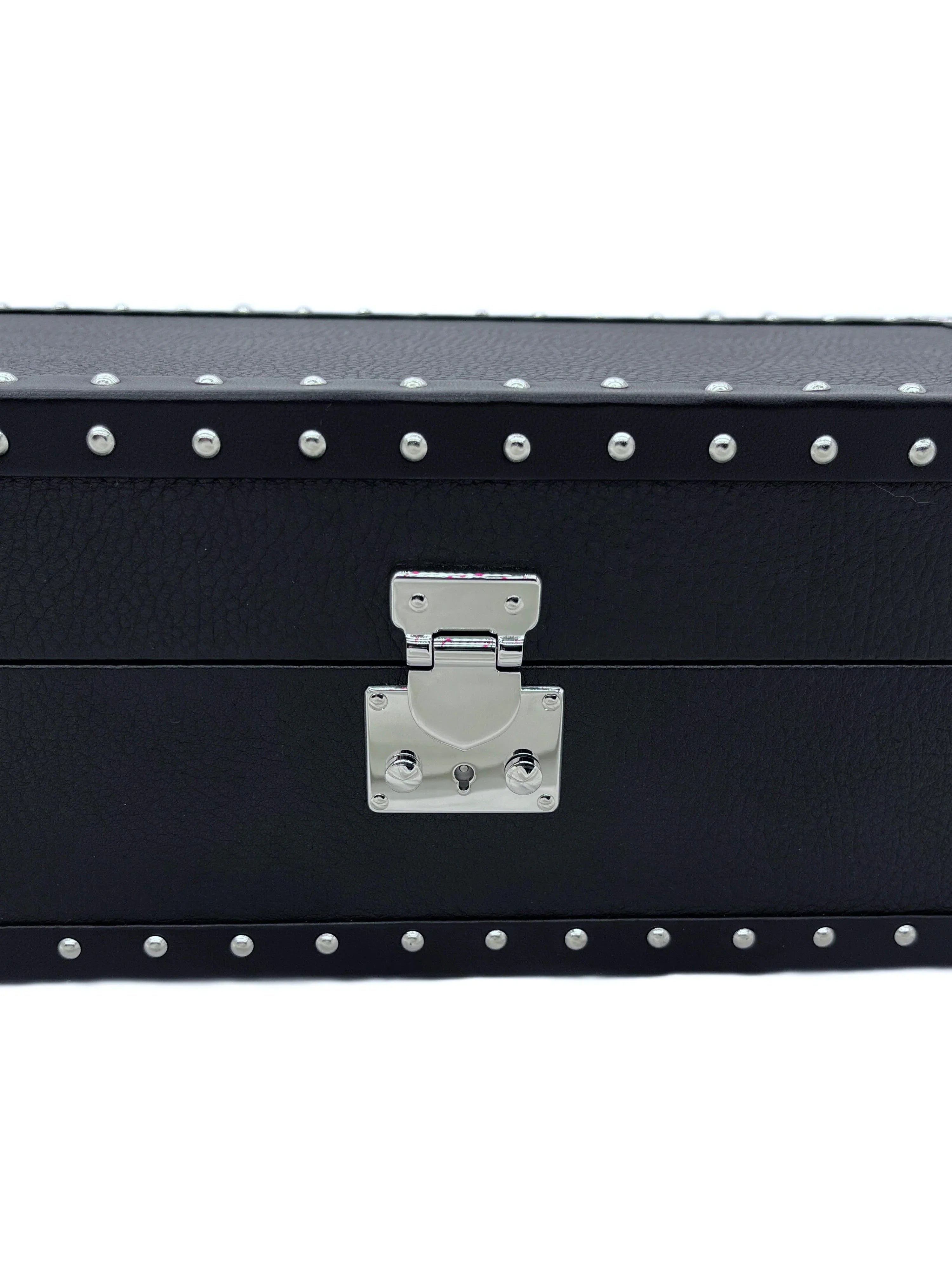 Black leather box with silver metal studs and latch, luxury handcrafted design