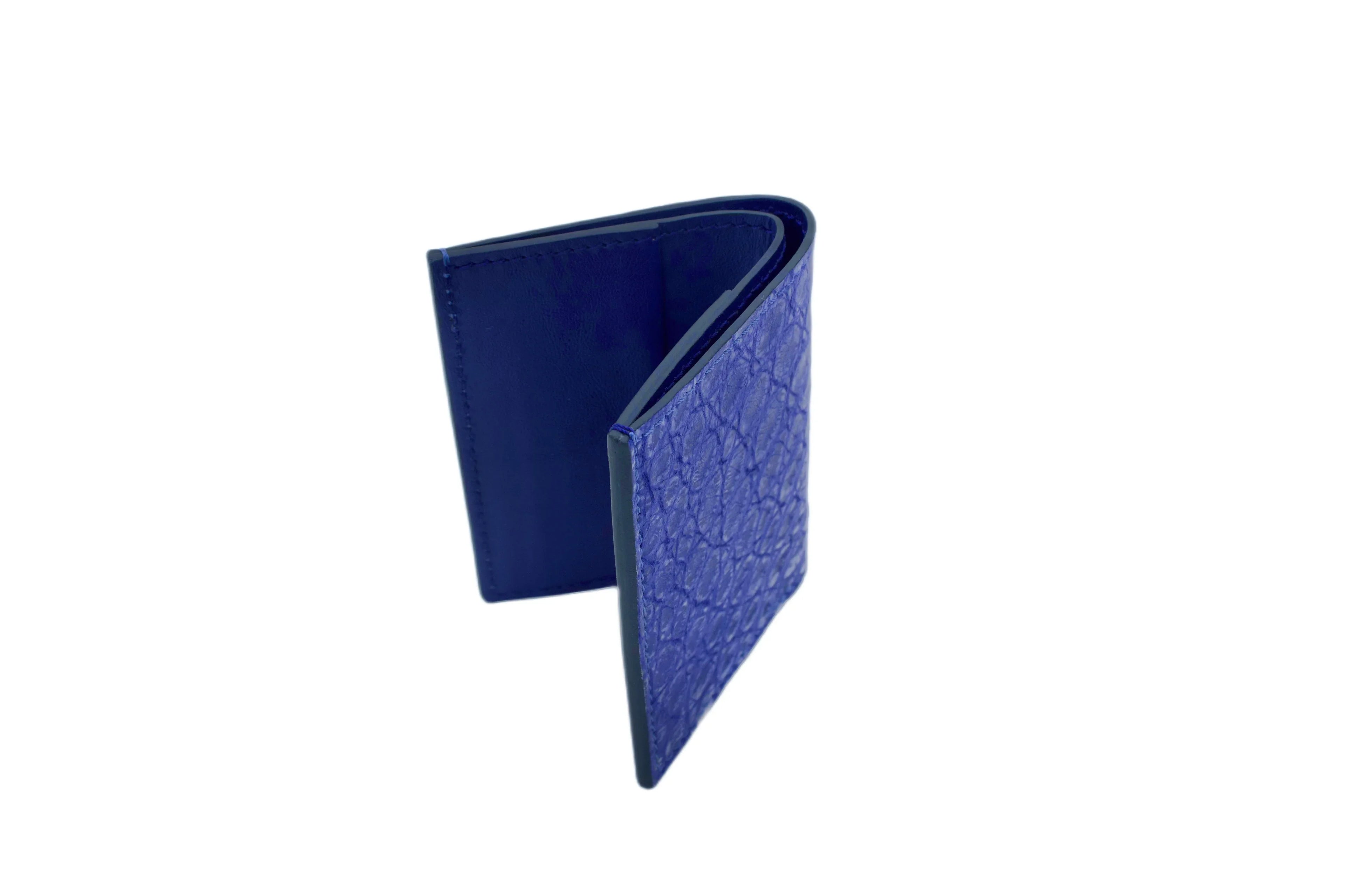 Luxury blue textured leather wallet standing on white background