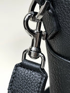 Black leather briefcase detail shot of stitching and hardware