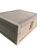Gray leather box with gold accents on a white background