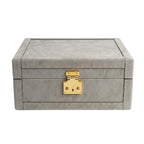 Gray leather box with gold accents on a white background