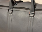 Weekend Bag in grey leather, side view showing structured shape