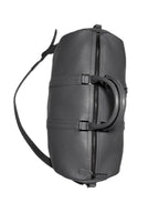 Weekend Bag in grey leather, open showing cotton-lined interior