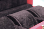3-Place Watchbox in red leather, close-up of brass clasp