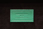 3-Place Watchbox in green leather, angled view on display