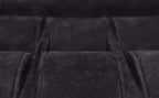 Close-up of black velvet-lined compartment, luxury leather goods storage detail