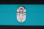8-Place Watchbox in turquoise and black leather, close-up of brass corner detail