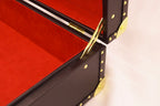 Briefcase x Trax NYC carried by handle, front view