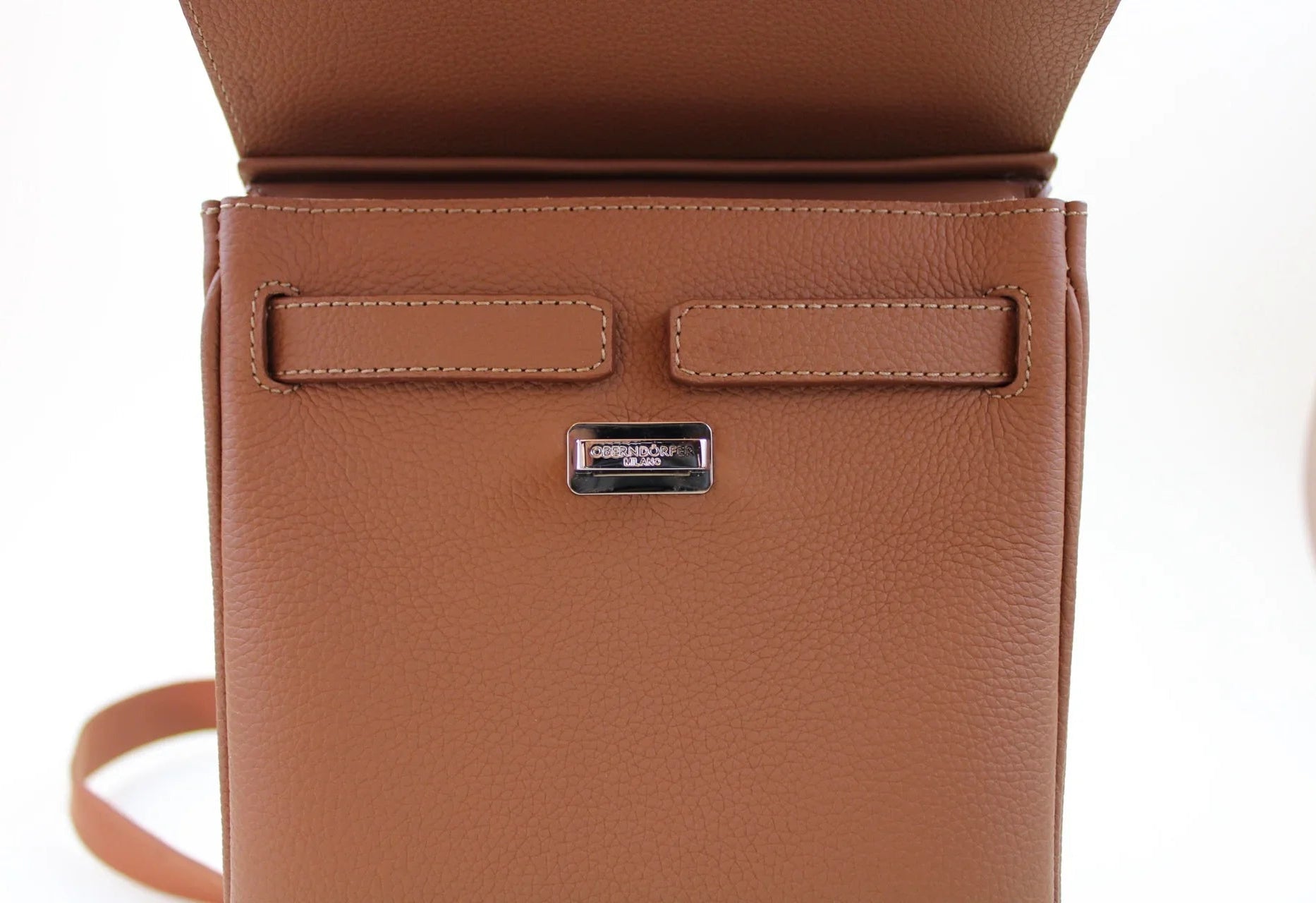 Brown leather belt bag with a visible brand logo on a white background