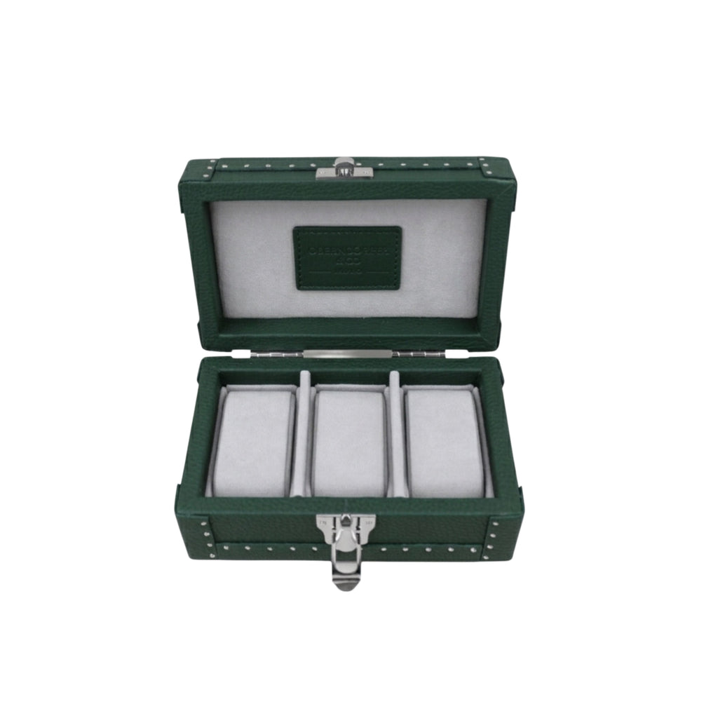 Green jewelry box with three compartments on a white background
