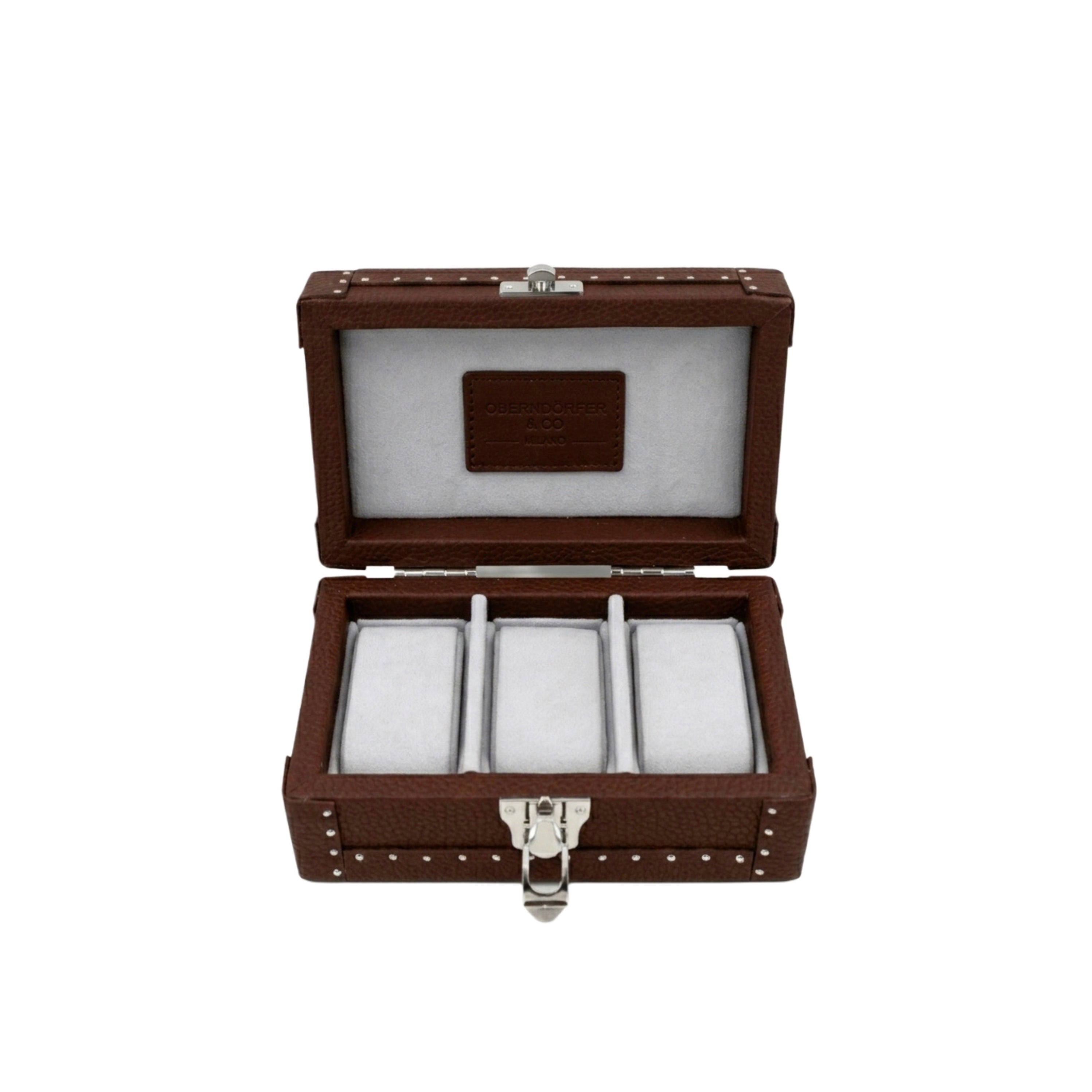 Open cognac leather watch box showing Alcantara-lined interior and
watch cushions - Oberndörfer
