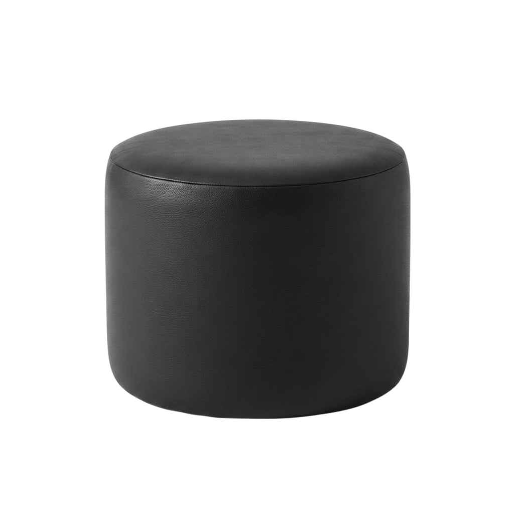 Round black Italian leather pouf against a white background
