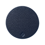 A round navy blue textured leather coaster on a solid white background.