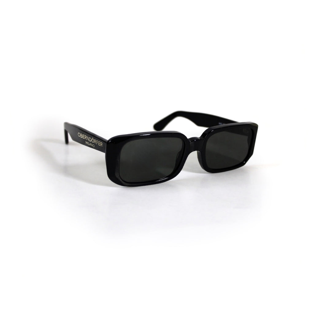 Oberndorfer Milano handmade black acetate rectangle sunglasses with solid dark German Zeiss lenses.