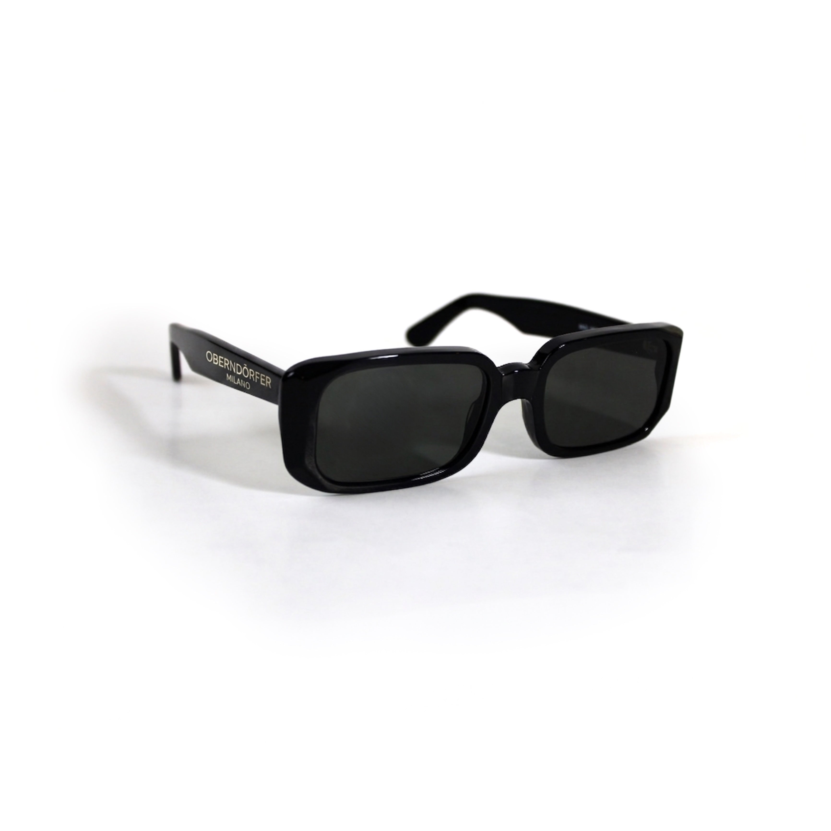 Oberndorfer Milano handmade black acetate rectangle sunglasses with solid dark German Zeiss lenses.