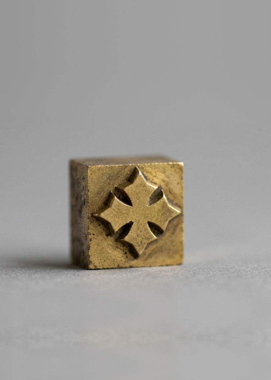 A brass stamp engraved with the Oberndörfer cross