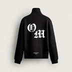 Half-Zip OM in black, back, O and M in white blackletter
