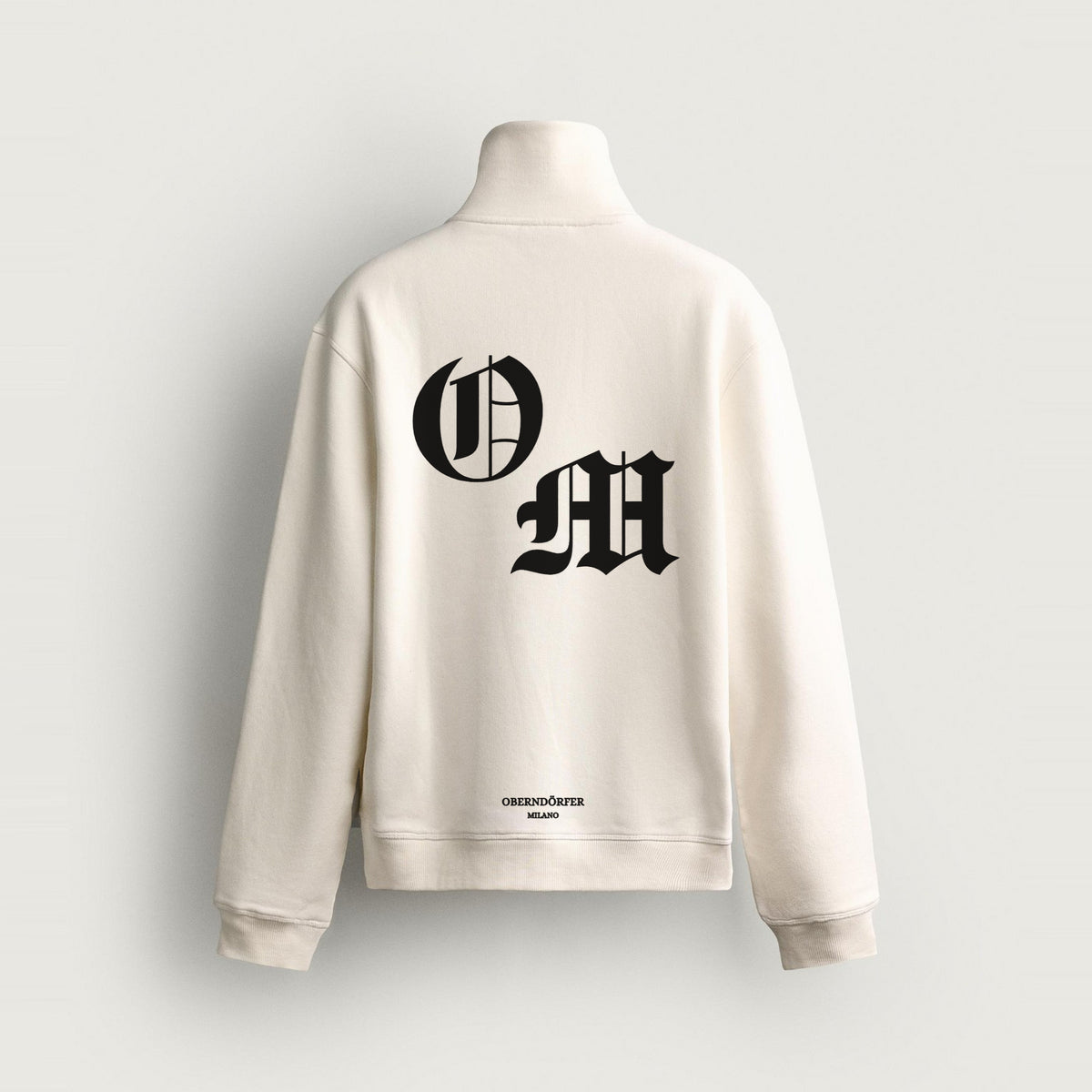 Half-Zip OM in white, back, O and M in black blackletter