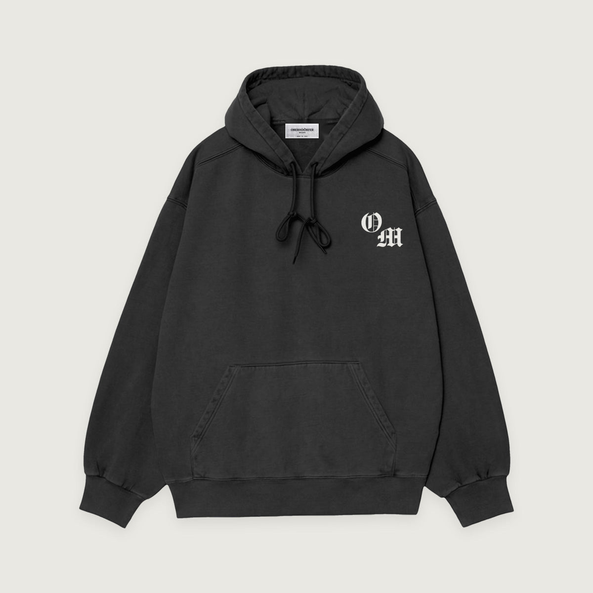 Hoodie with Logo in black, front, OM monogram at the chest