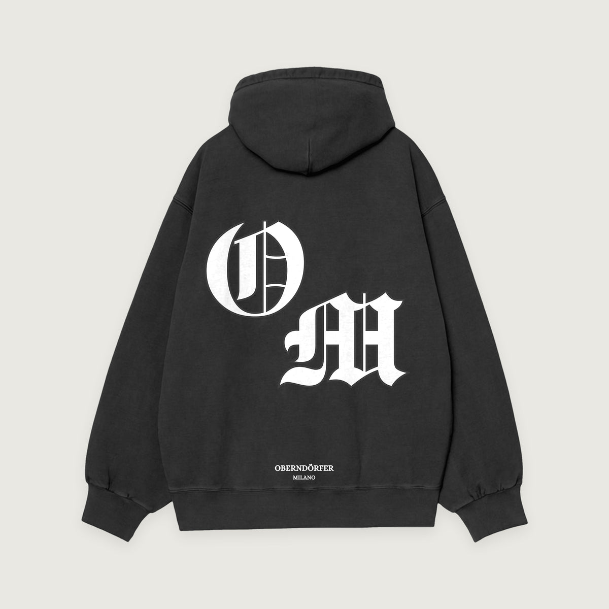 Hoodie OM in black, back, interlocking O and M in white blackletter