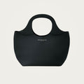Bag Model 017 in black Togo leather on an ivory studio ground