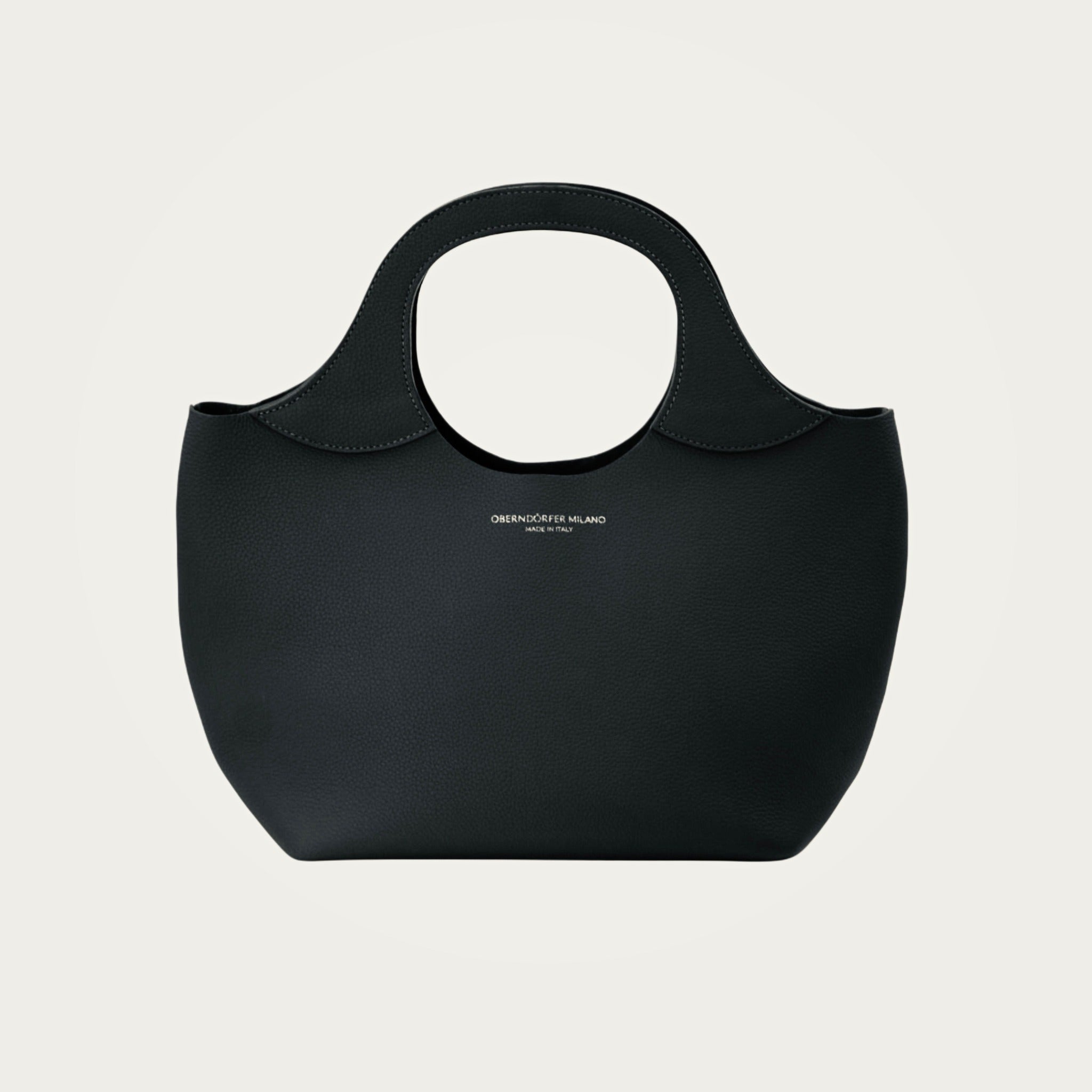 Bag Model 017 in black Togo leather on an ivory studio ground