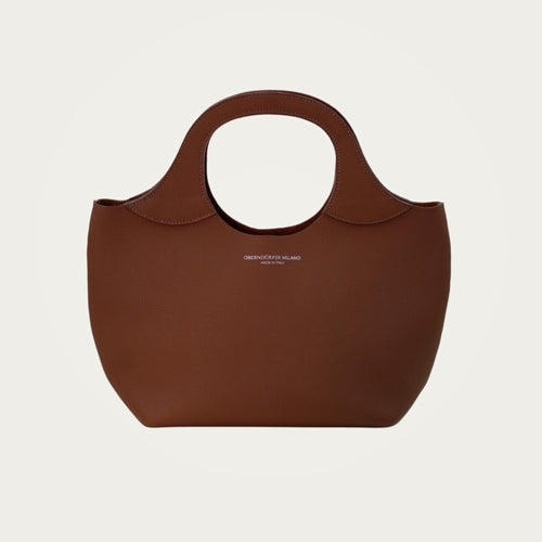 Bag Model 017 in brown Togo leather on an ivory studio ground