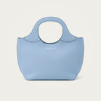 Bag Model 017 in light blue Togo leather on an ivory studio ground