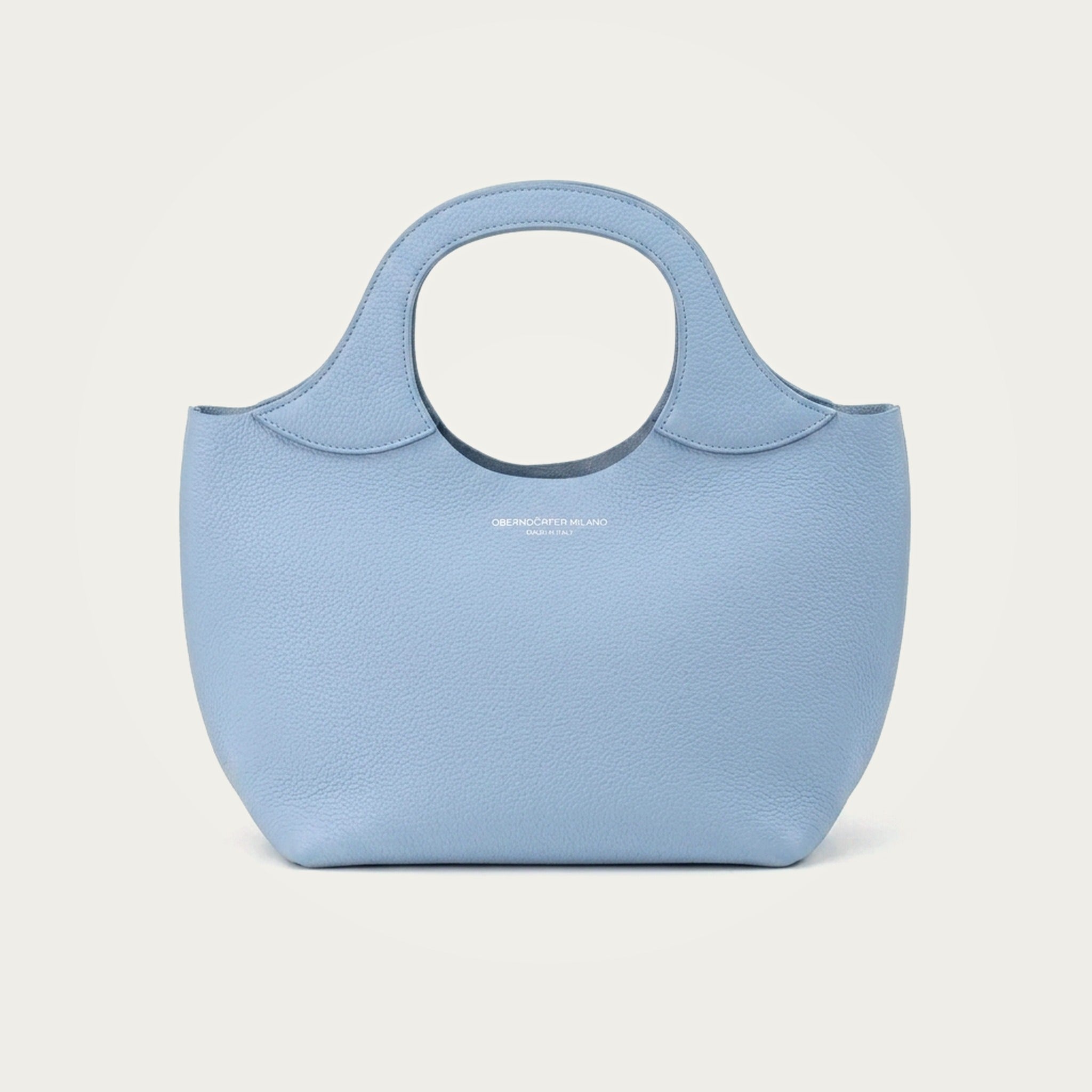 Bag Model 017 in light blue Togo leather on an ivory studio ground