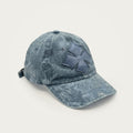 Washed cotton cap in faded stone blue with the Oberndörfer logo cut from calf leather, made in Italy