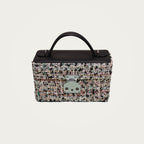 The Mirror Handbag in black tweed on an ivory studio ground