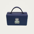 The Mirror Handbag in blue leather on an ivory studio ground