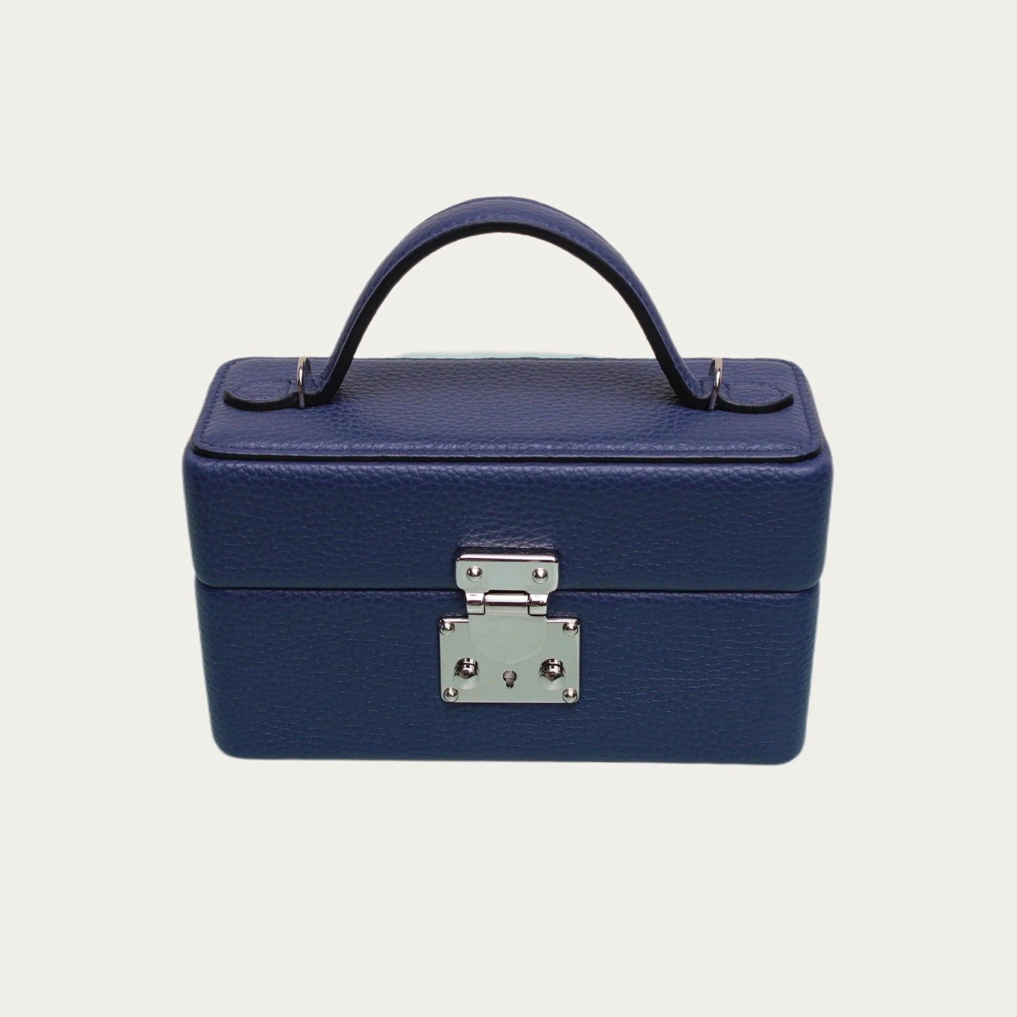 The Mirror Handbag in blue leather on an ivory studio ground