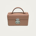 The Mirror Handbag in nude leather on an ivory studio ground