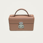 The Mirror Handbag in nude leather on an ivory studio ground