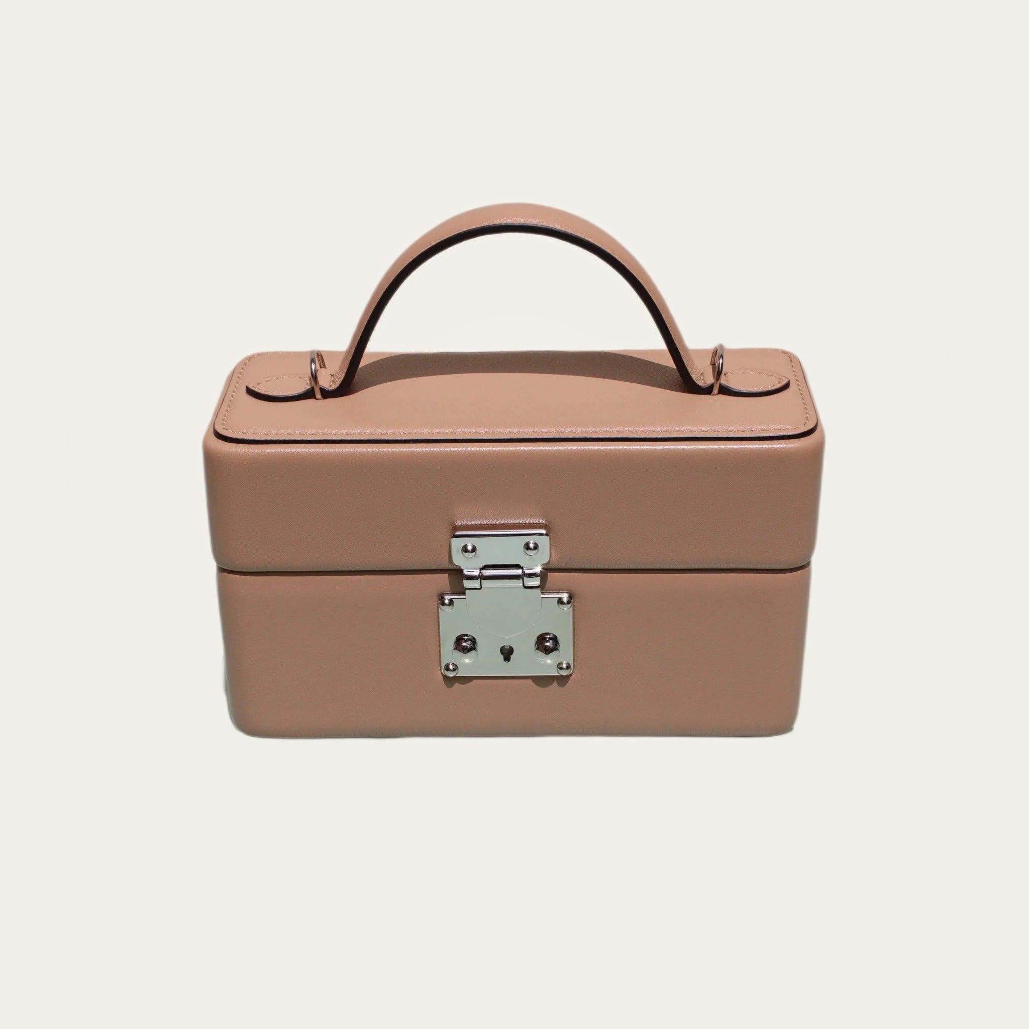 The Mirror Handbag in nude leather on an ivory studio ground