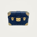 Ostrich Mini Trunk Handbag on an ivory studio ground
