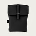 SAC in black Togo leather on an ivory studio ground