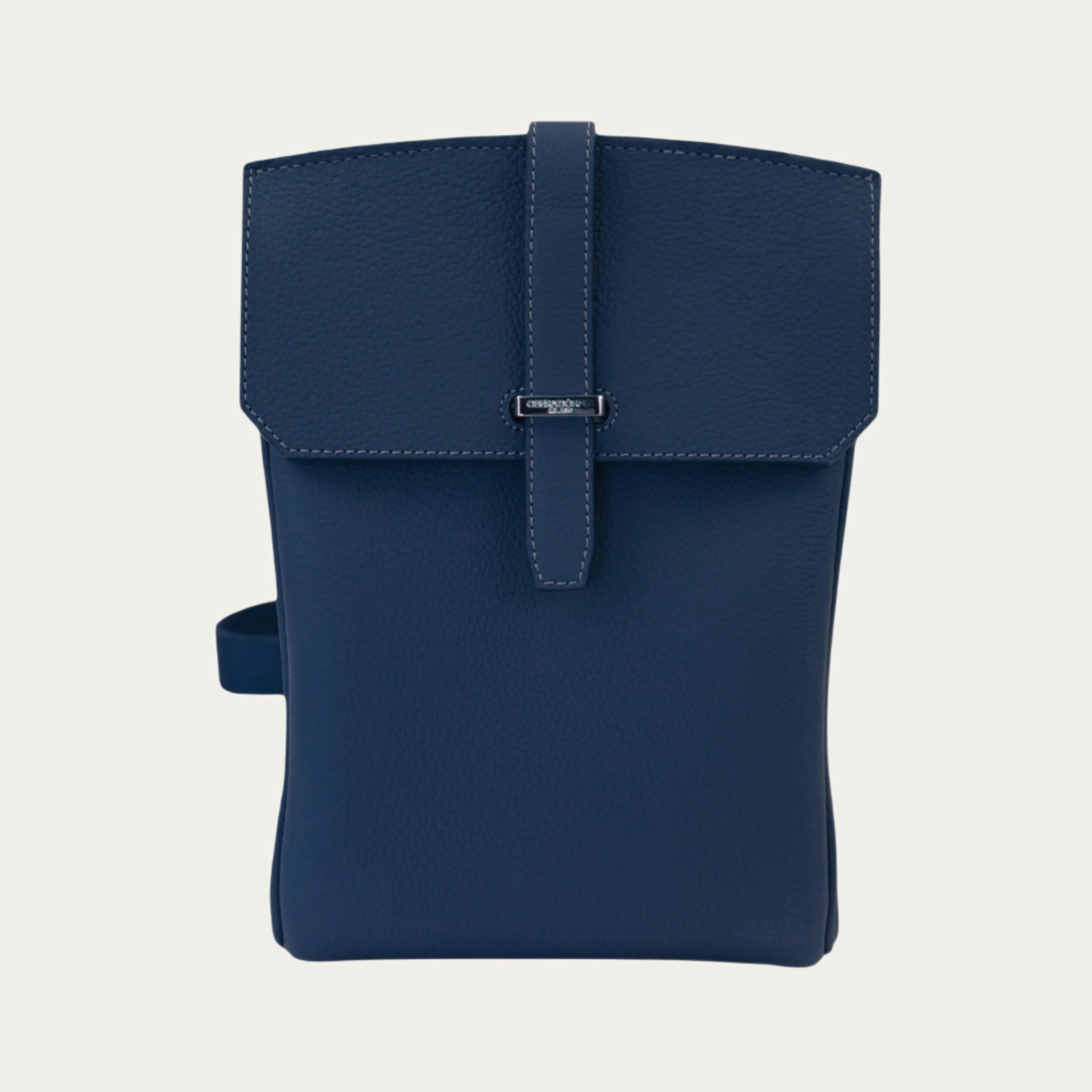 SAC in blue Togo leather on an ivory studio ground