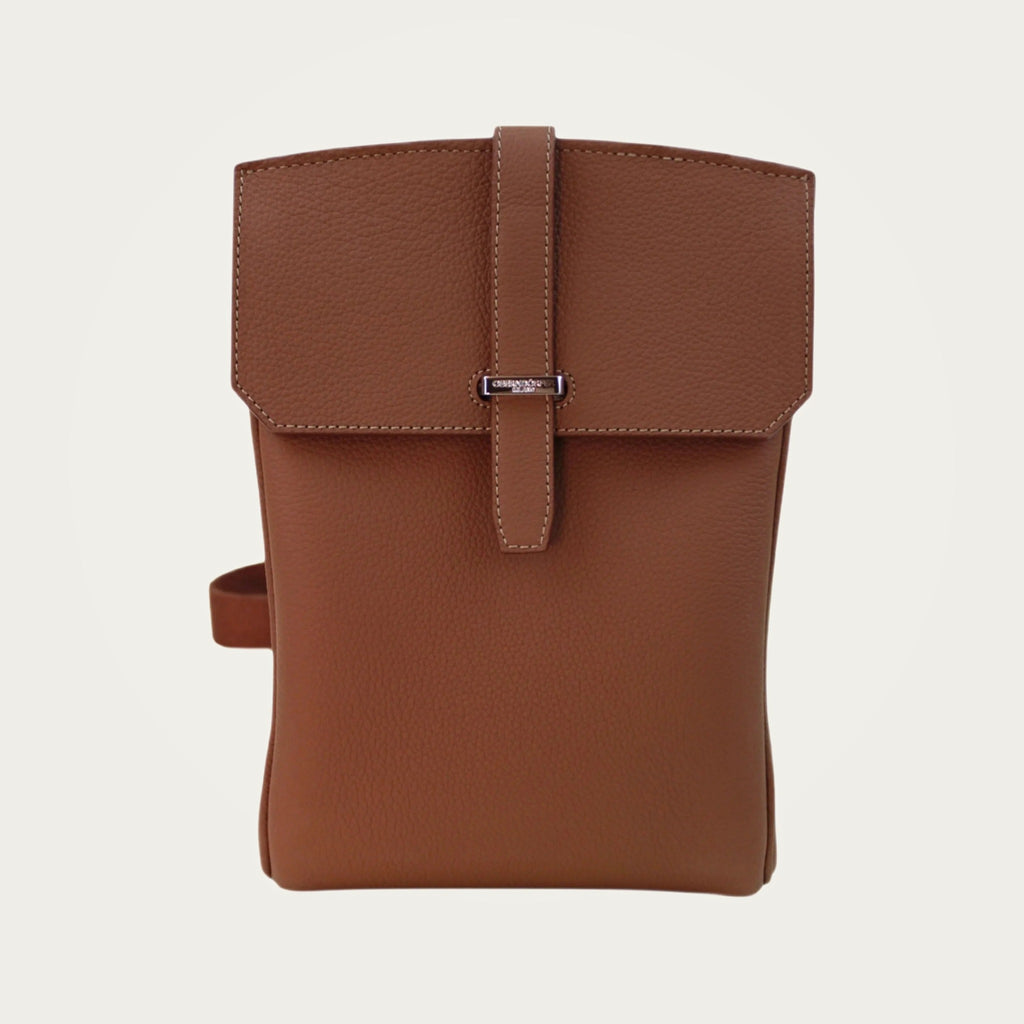 SAC in brown Togo leather on an ivory studio ground
