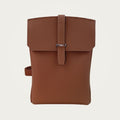 SAC in brown Togo leather on an ivory studio ground
